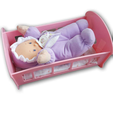 Doll with cot